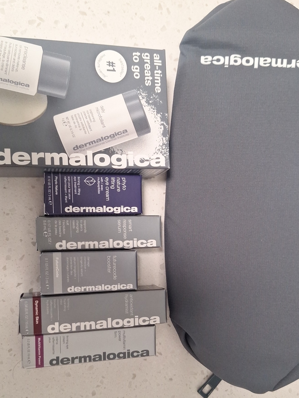 dermalogica skincare set with gray travel pouch